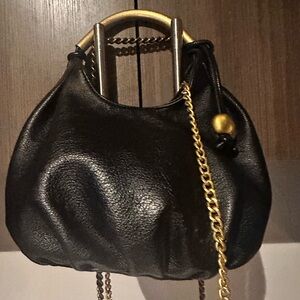 Elegant Black Leather Handbag with Gold Accents